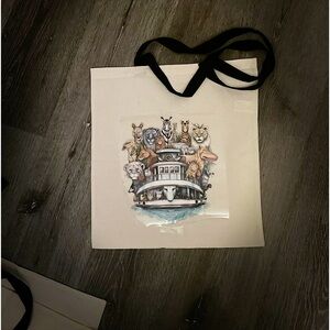 Cream & black top bag displaying a picture of Noah’s ark large 17In-L 15In-W